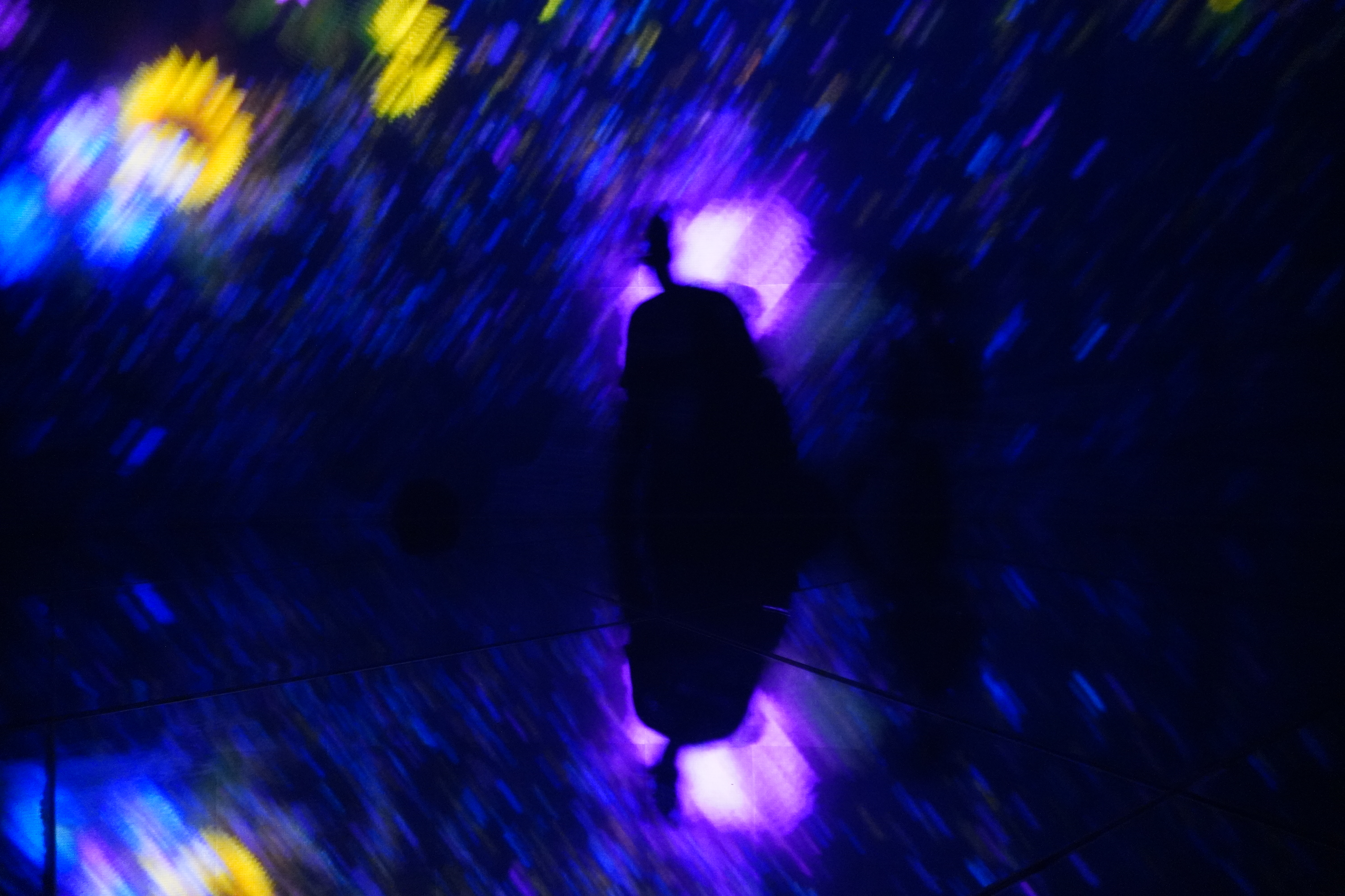 Vivid graffiti of a stork and large eyeball on a wall in Tokyo.