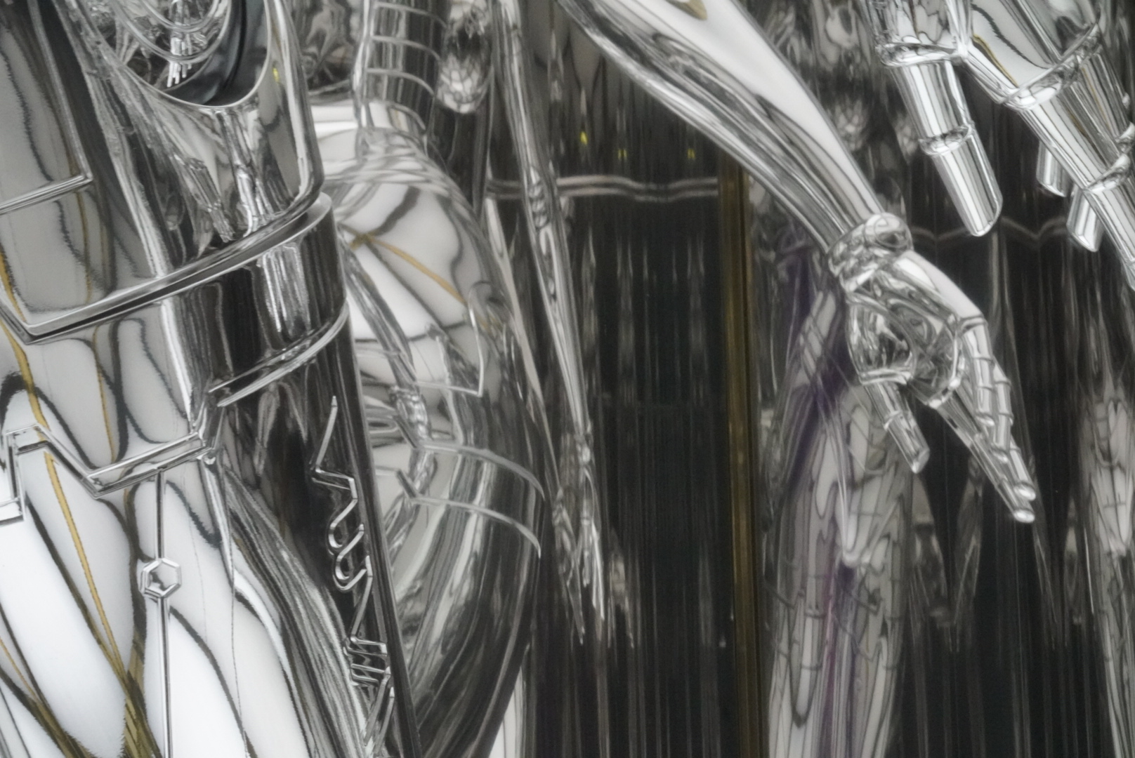 Sexy robot waist and hand in mirror reflection.